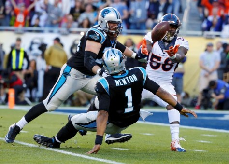 Denver Broncos' Miller strips the ball away from Carolina Panthers' quarterback Newton on a sack leading to a Denver recovery in the end zone for a touchdown in the first quarter during the NFL's Super Bowl 50 football game in Santa Clara